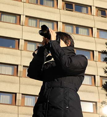 Woman Investigator Taking Photo